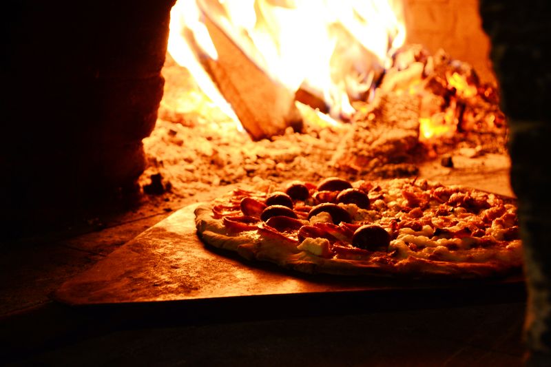 Punch pizza signature Margherita with fresh mozzarella and basil