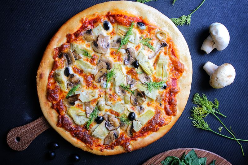 Spinach artichoke white pizza